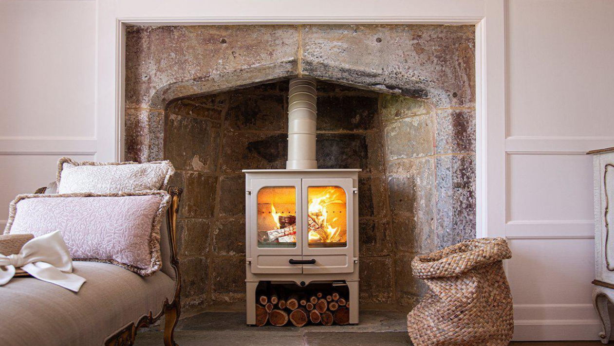 Cream stove in a fireplace